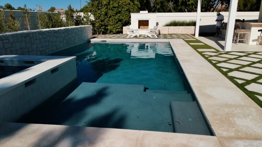 Rectangular swimming pool with fire feature and modern decking in Scottsdale Arizona