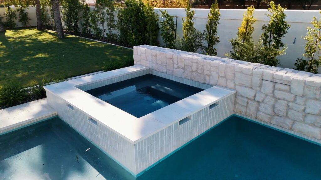 Raised spa and pool with stone accents in Gilbert Arizona custom design