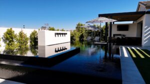 Modern home with reflecting pool and landscaping in Phoenix Arizona