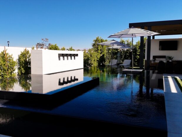Modern home with reflecting pool and landscaping in Phoenix Arizona