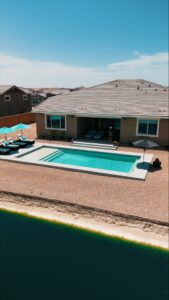 Thumbnail of http://Aerial%20view%20of%20narrow%20backyard%20lap%20pool%20along%20lakeside%20canal%20in%20Mesa%20Arizona%20constructed%20by%20Caribbean%20Pools
