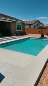 Thumbnail of http://Compact%20backyard%20swimming%20pool%20with%20built-in%20steps%20and%20sun%20ledge%20in%20Glendale%20Arizona%20constructed%20by%20Caribbean%20Pools