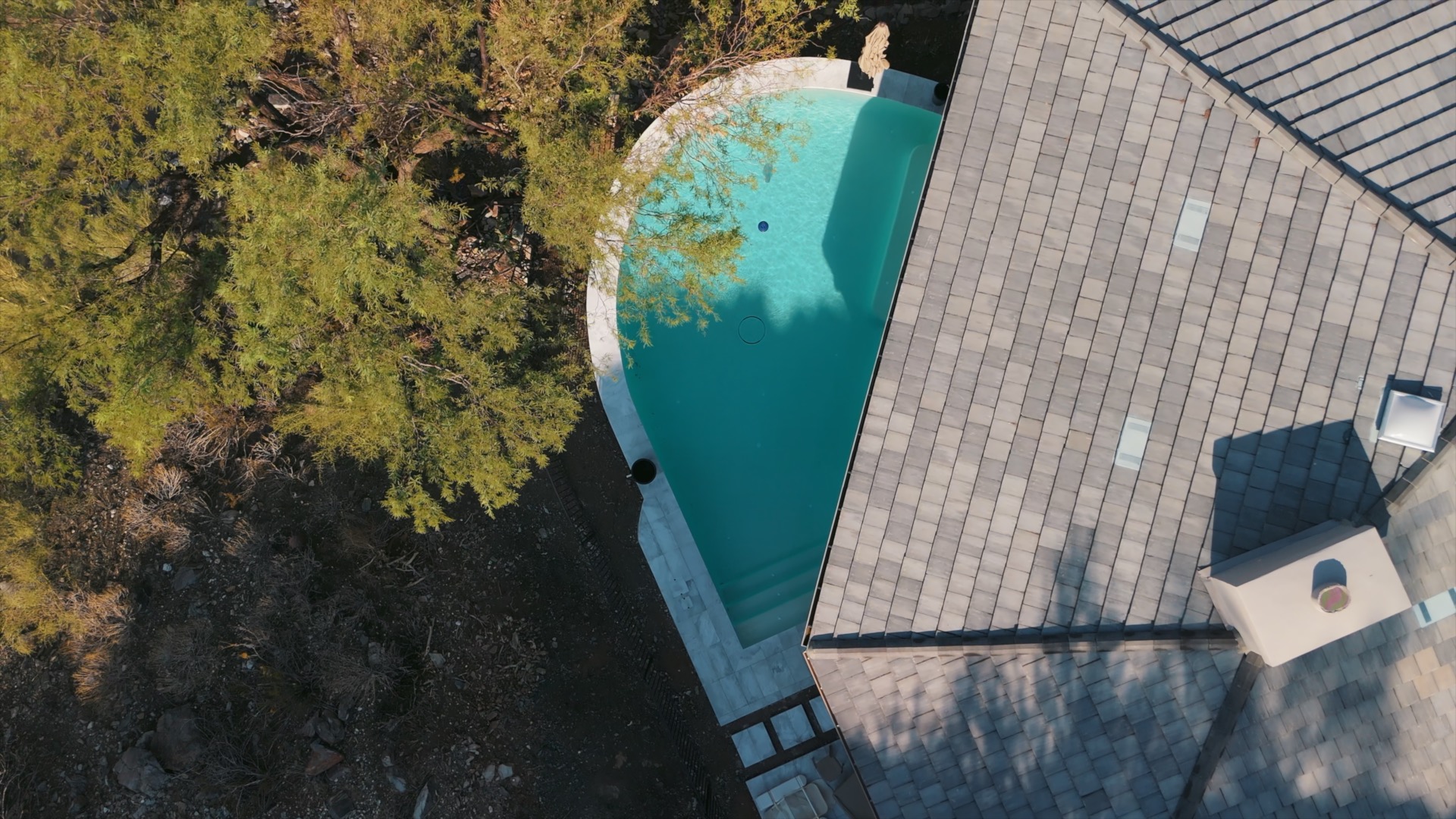 Custom freeform inground pool with raised spa by Caribbean Pools in Mesa AZ